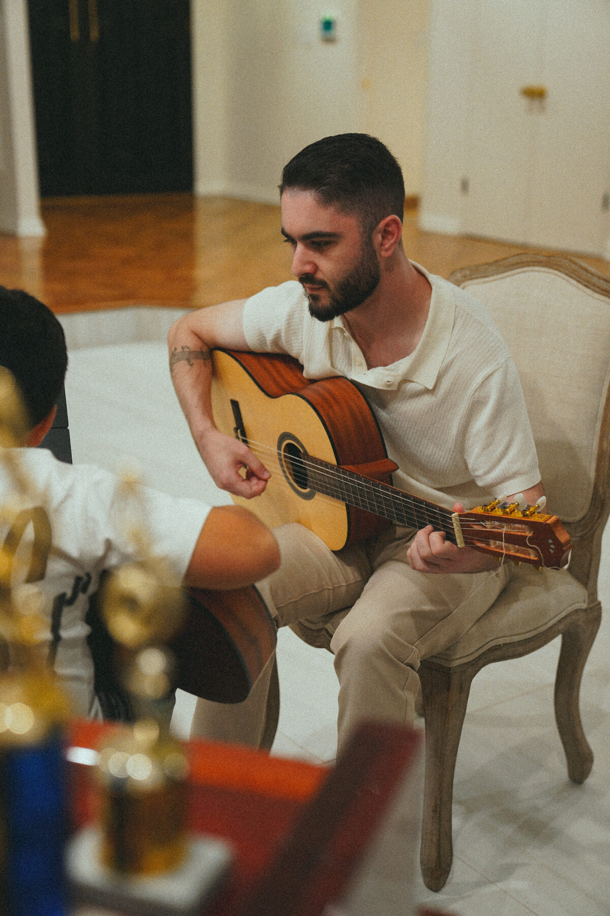 Guitar instructor teaching a private lesson